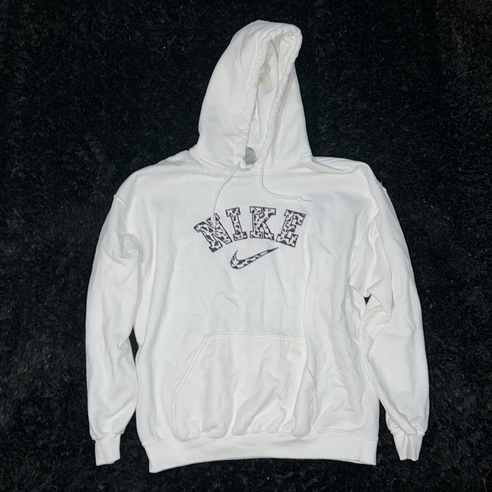 Large white hoodie with Nike logo cow print embroidered on the front